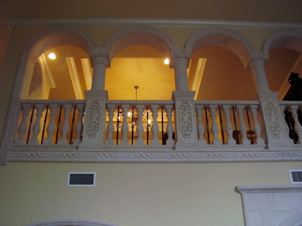 stone balustrade systems. Her the use of stone and ornate metal balusters sets off this upper floor detail